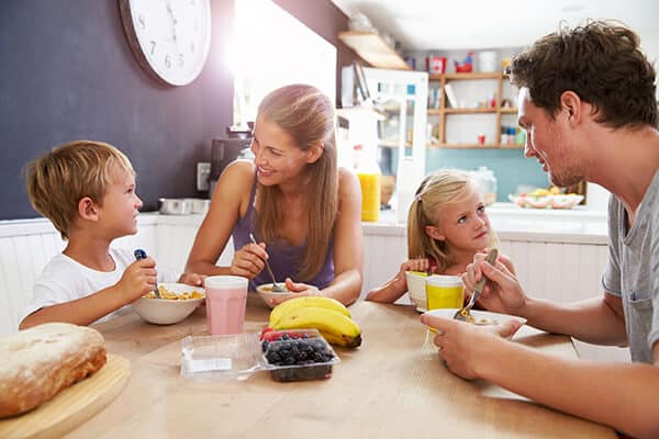 Family Eating Breakfast Together in the Kitchen